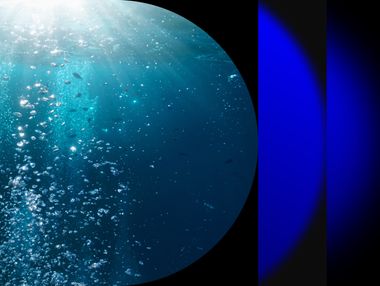 Photo of underwater bubbles and sunlight rays